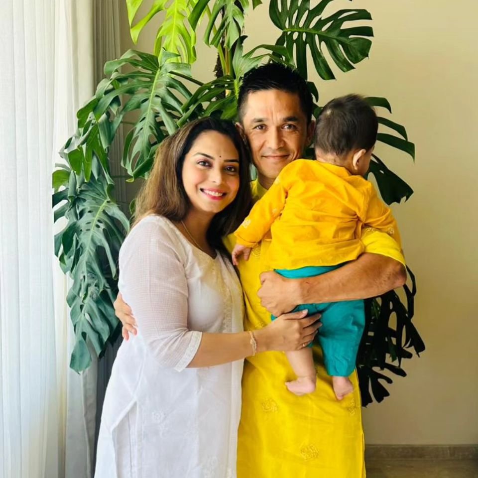 Sunil Chhetri with his wife and son, sharing a tender family moment.